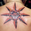 Renkli Tribal Gülen Güneş Tattoo